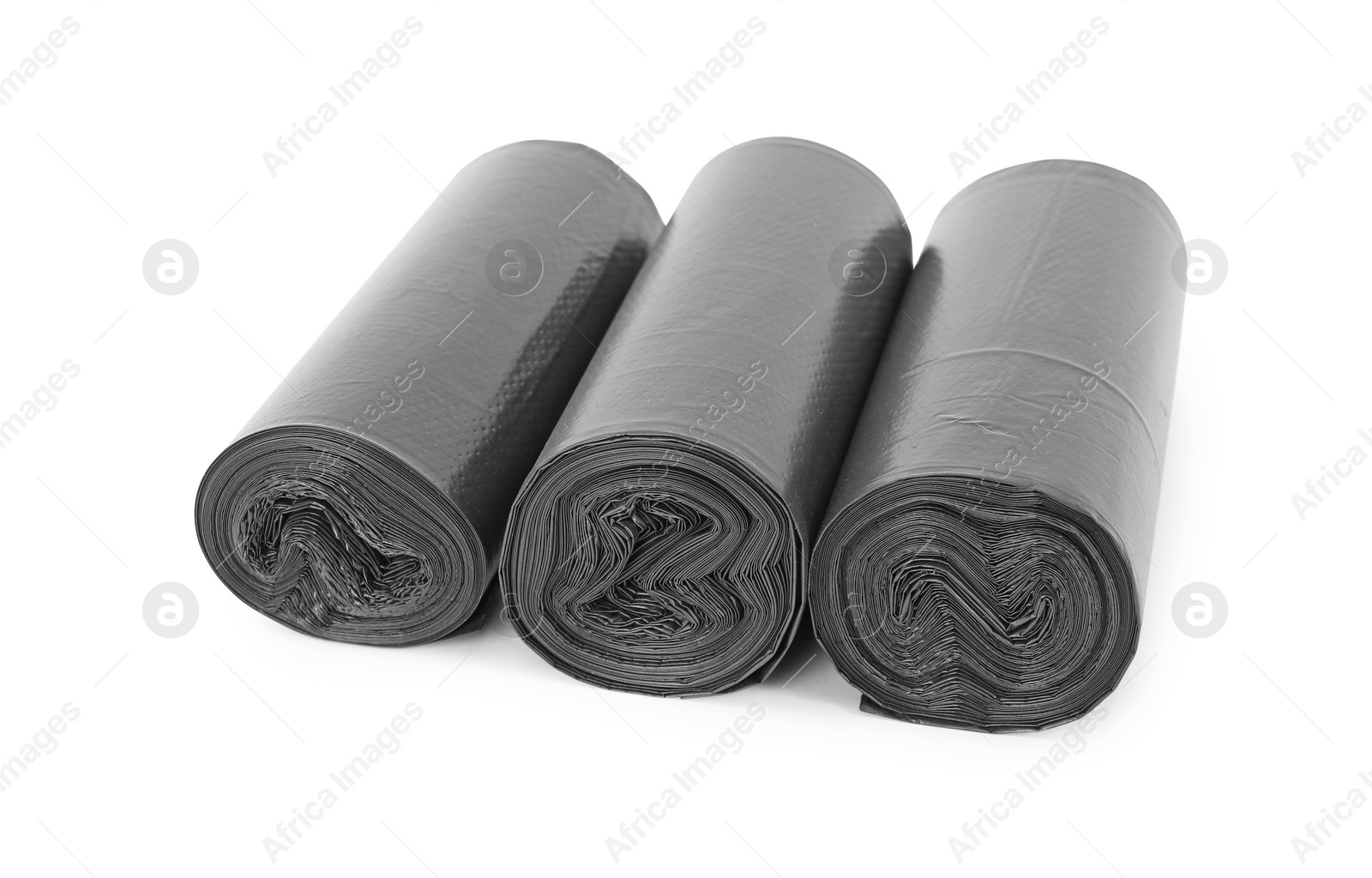 Photo of Rolls of black garbage bags isolated on white