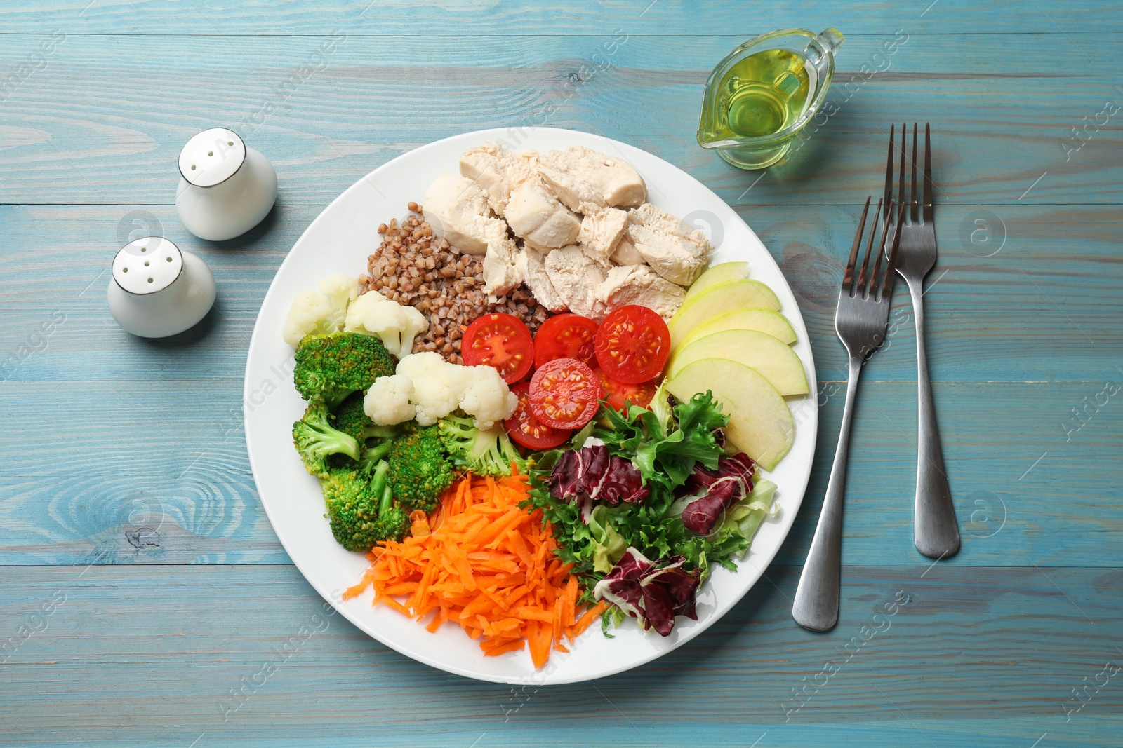 Photo of Balanced diet and healthy foods. Plate with different delicious products served on blue wooden table, top view