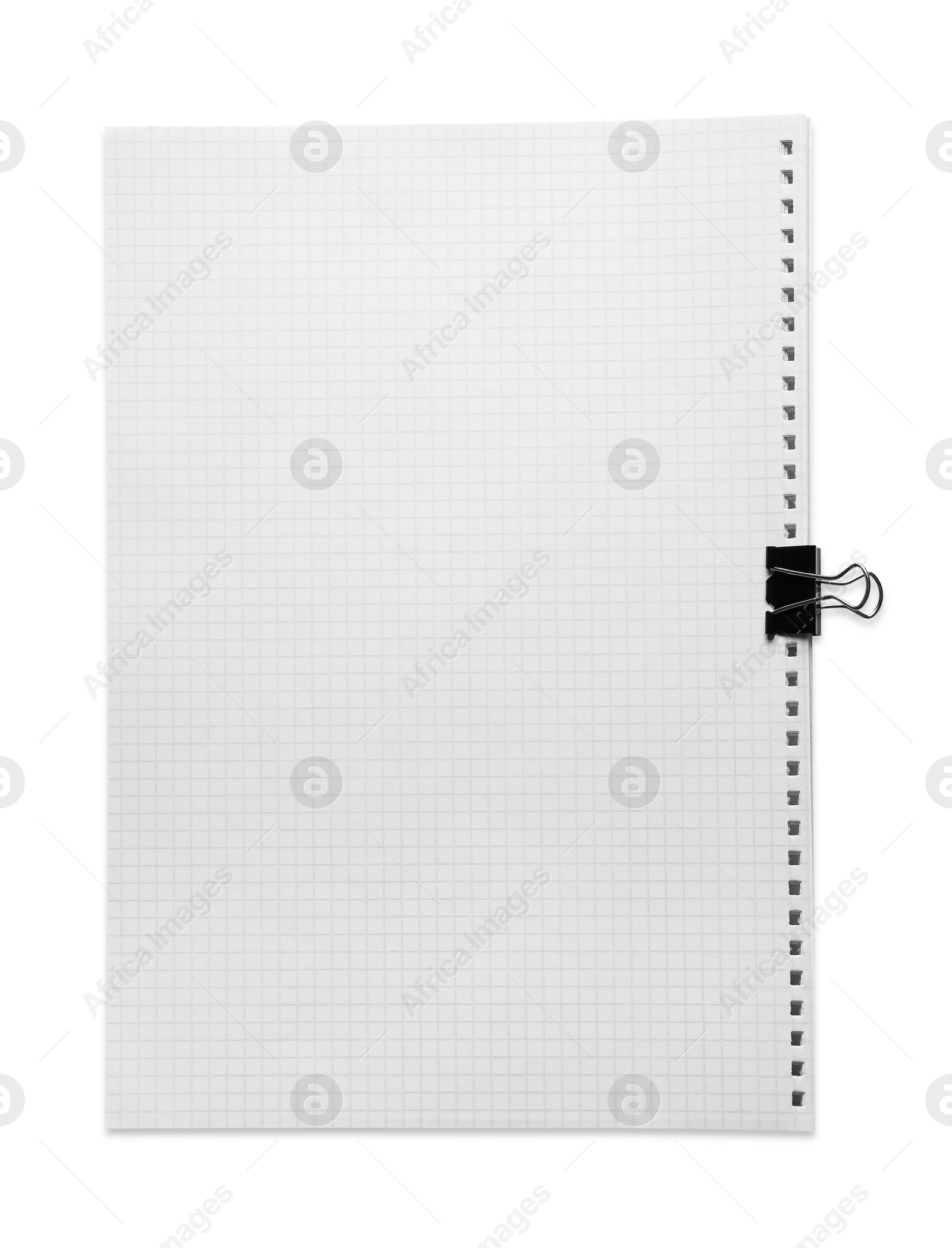 Photo of Checkered sheets of paper with binder clip on white background, top view