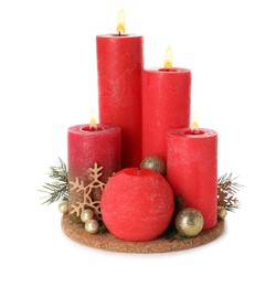 Photo of Burning red candles with Christmas decor isolated on white