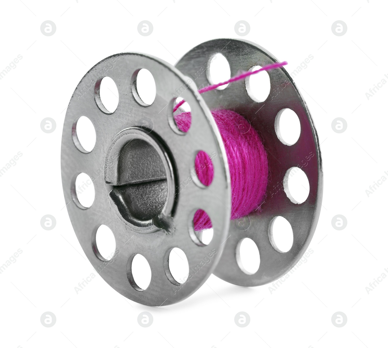 Photo of Metal spool of bright pink sewing thread isolated on white