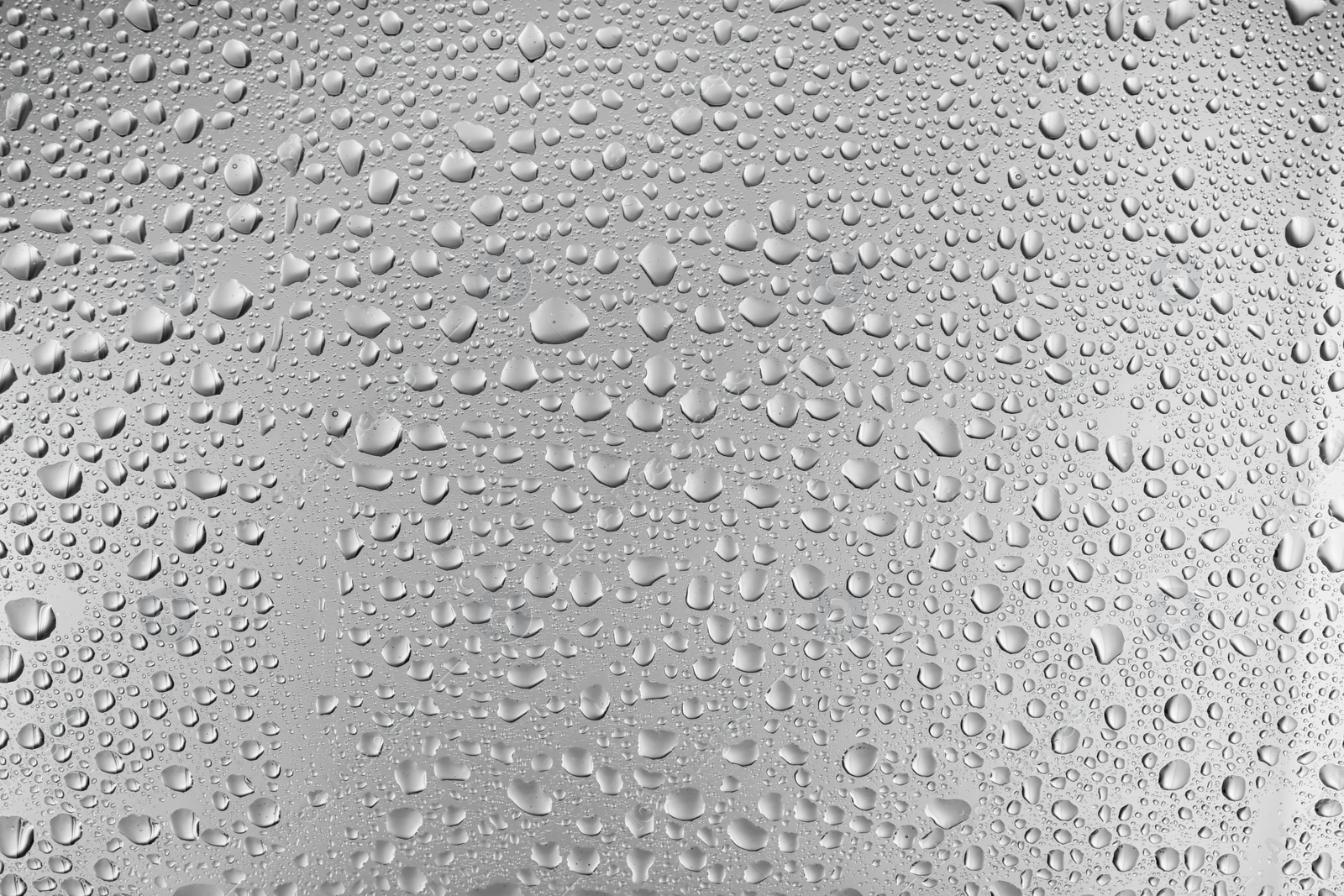 Photo of View of glass with water drops, closeup