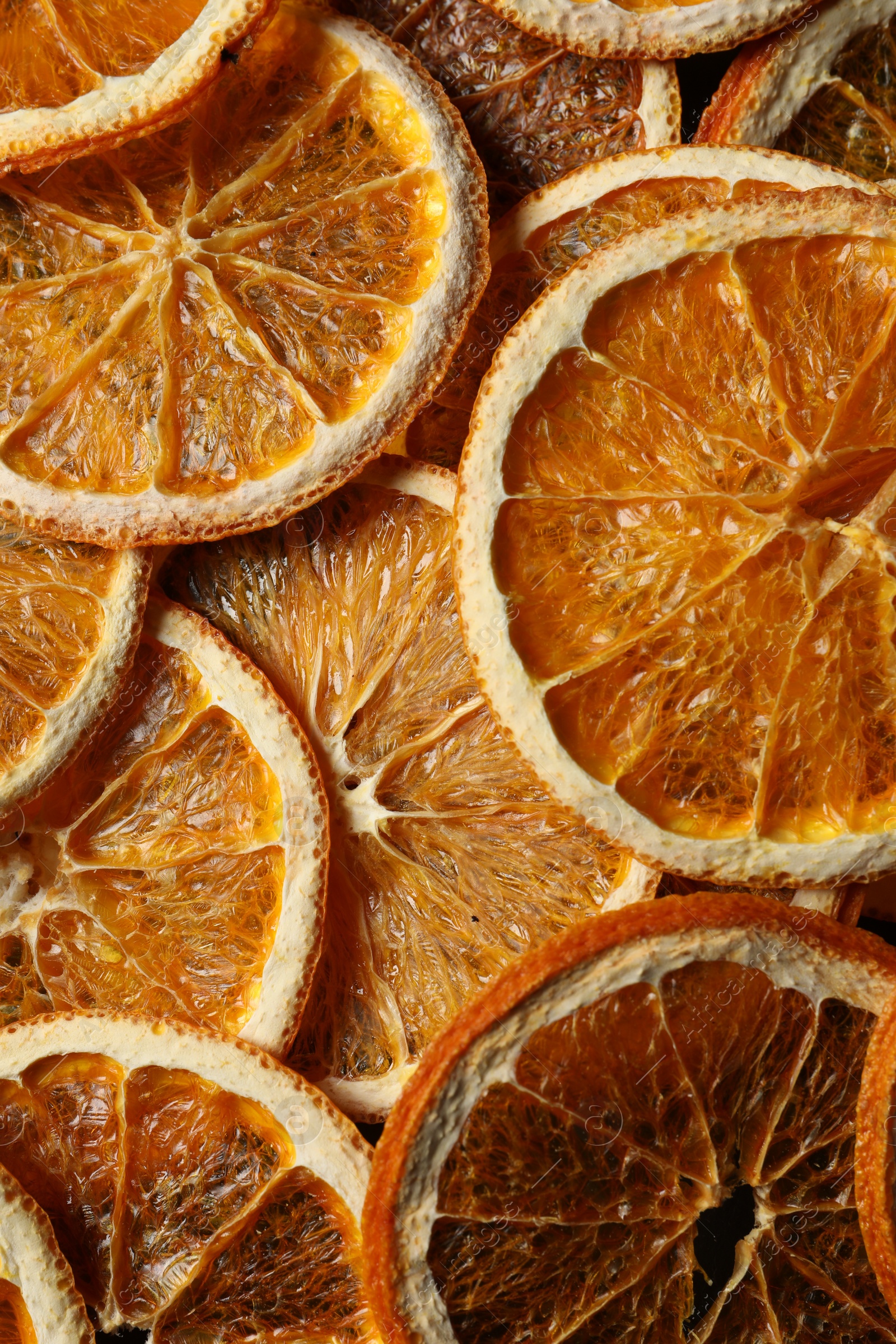 Photo of Many dry orange slices as background, top view