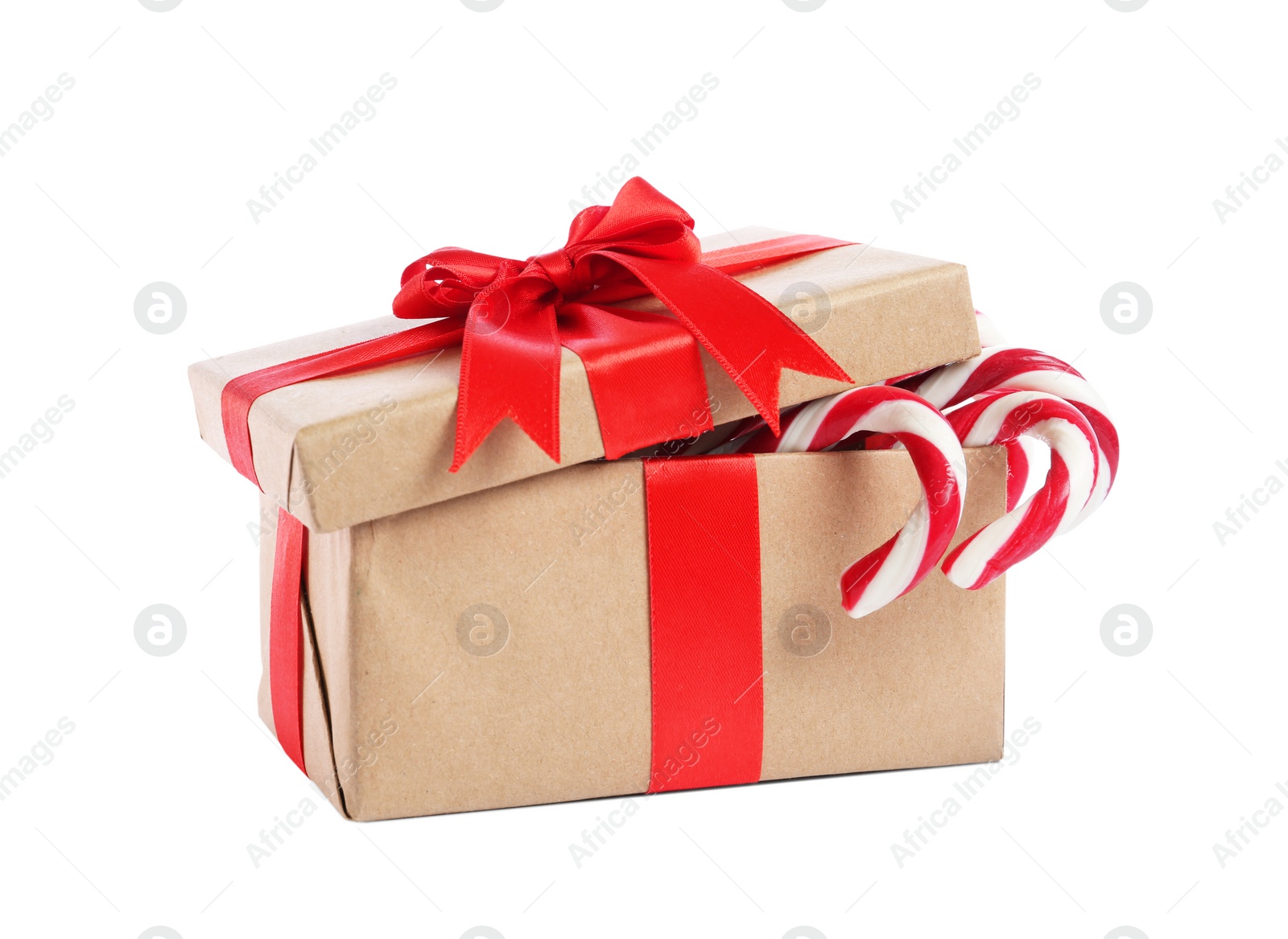 Image of Christmas gift box with candy canes on white background