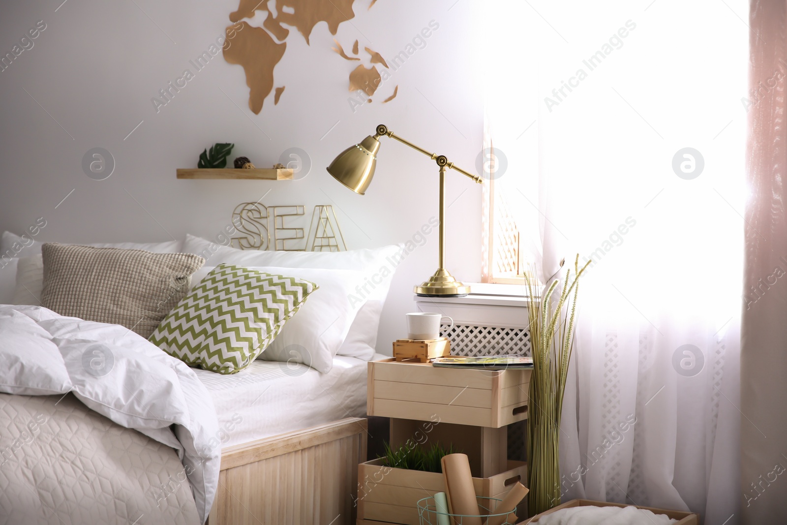 Photo of Modern eco style interior with wooden crates and comfortable bed
