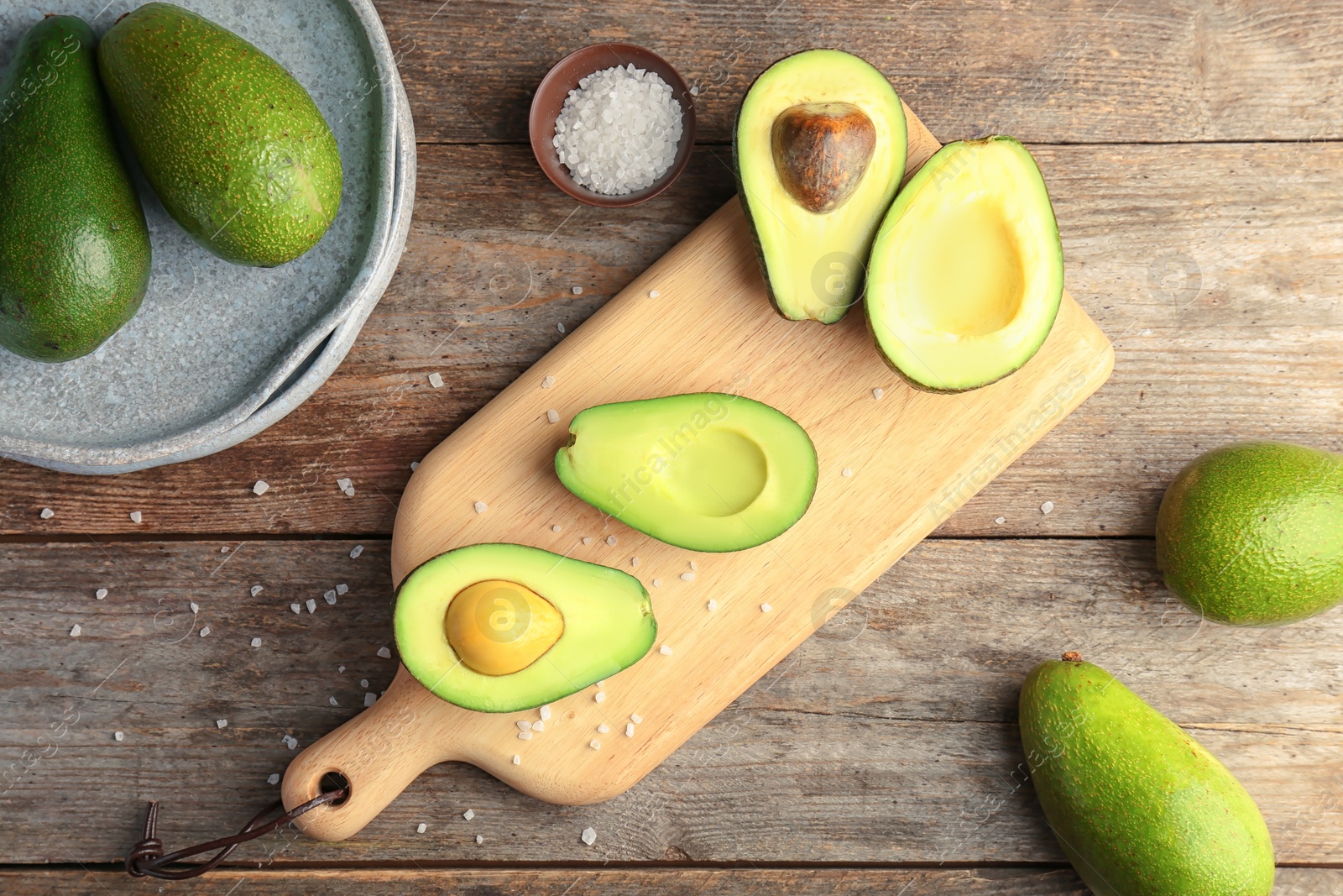 Photo of Flat lay composition with ripe avocados on wooden background