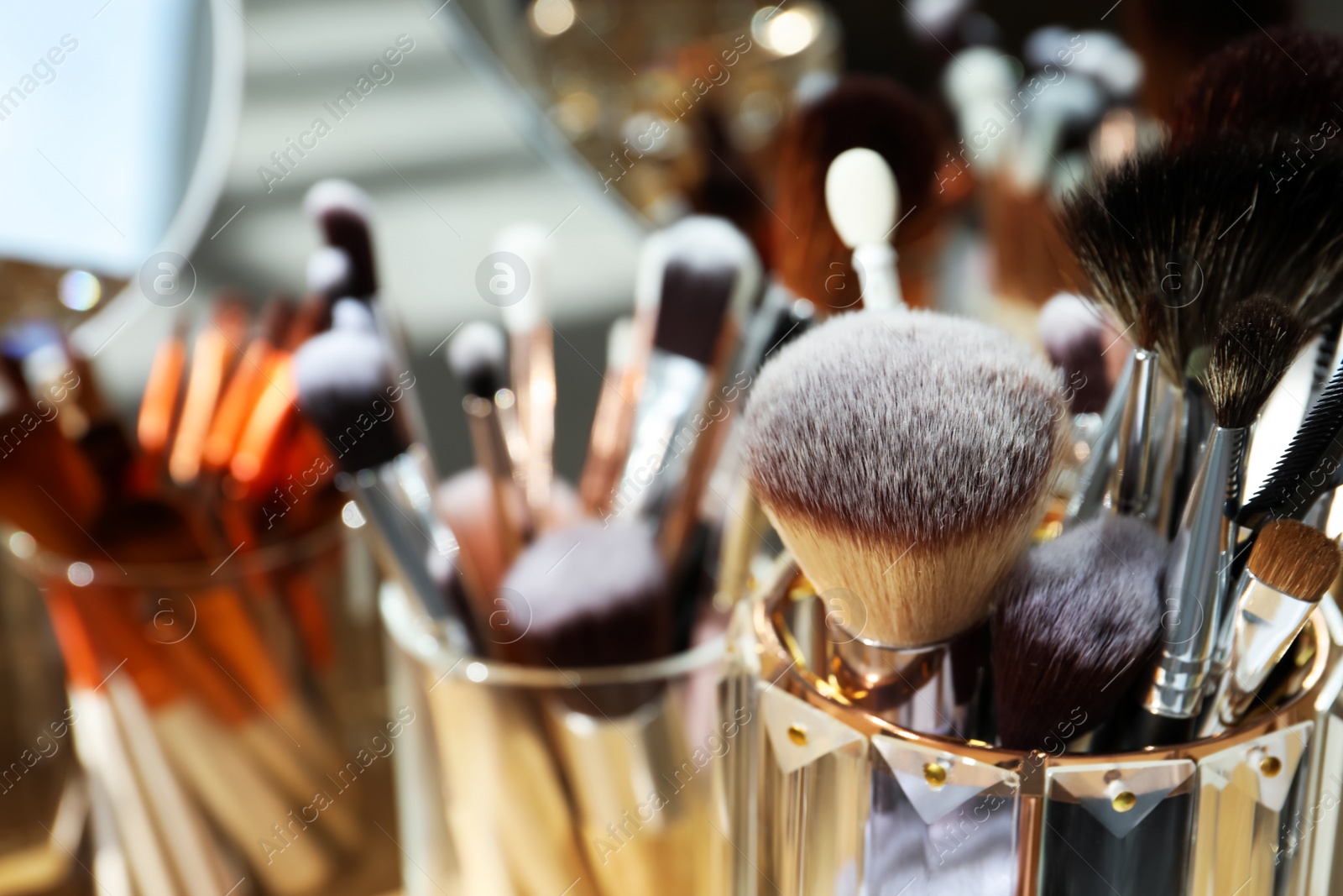 Photo of Set of professional brushes and mirror, closeup