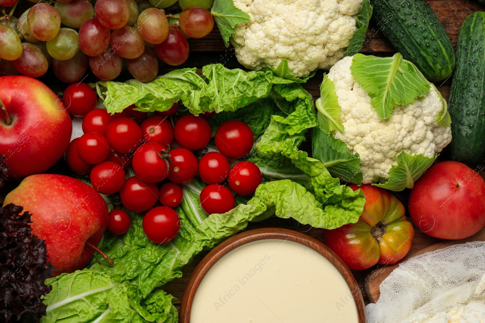 Photo of Different fresh ripe vegetables, sour cream and fruits as background, top view. Farmer produce