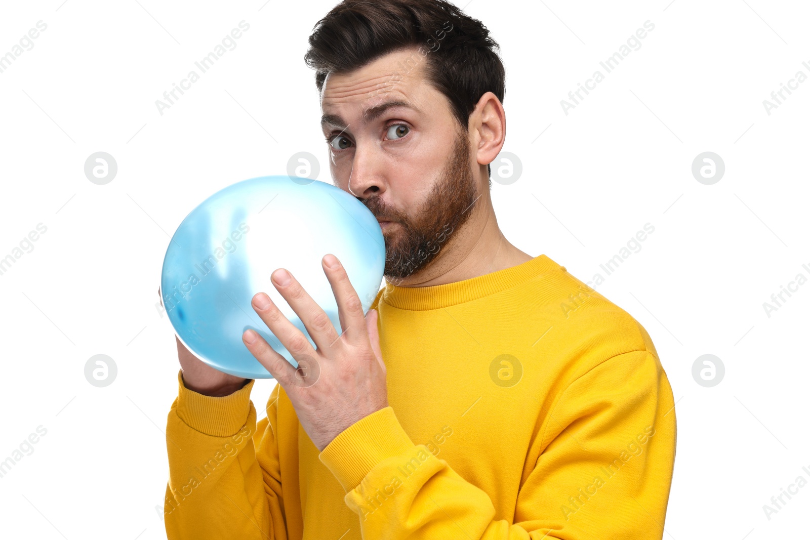 Photo of Man inflating light blue balloon on white background
