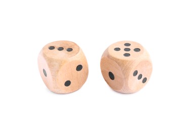 Photo of Two wooden game dices isolated on white