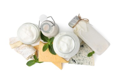 Photo of Different dairy products and mint isolated on white, top view