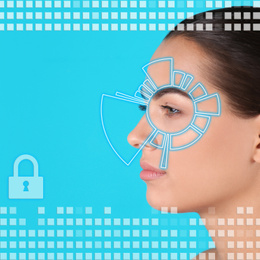 Facial recognition system. Woman scanned by iris on blue background