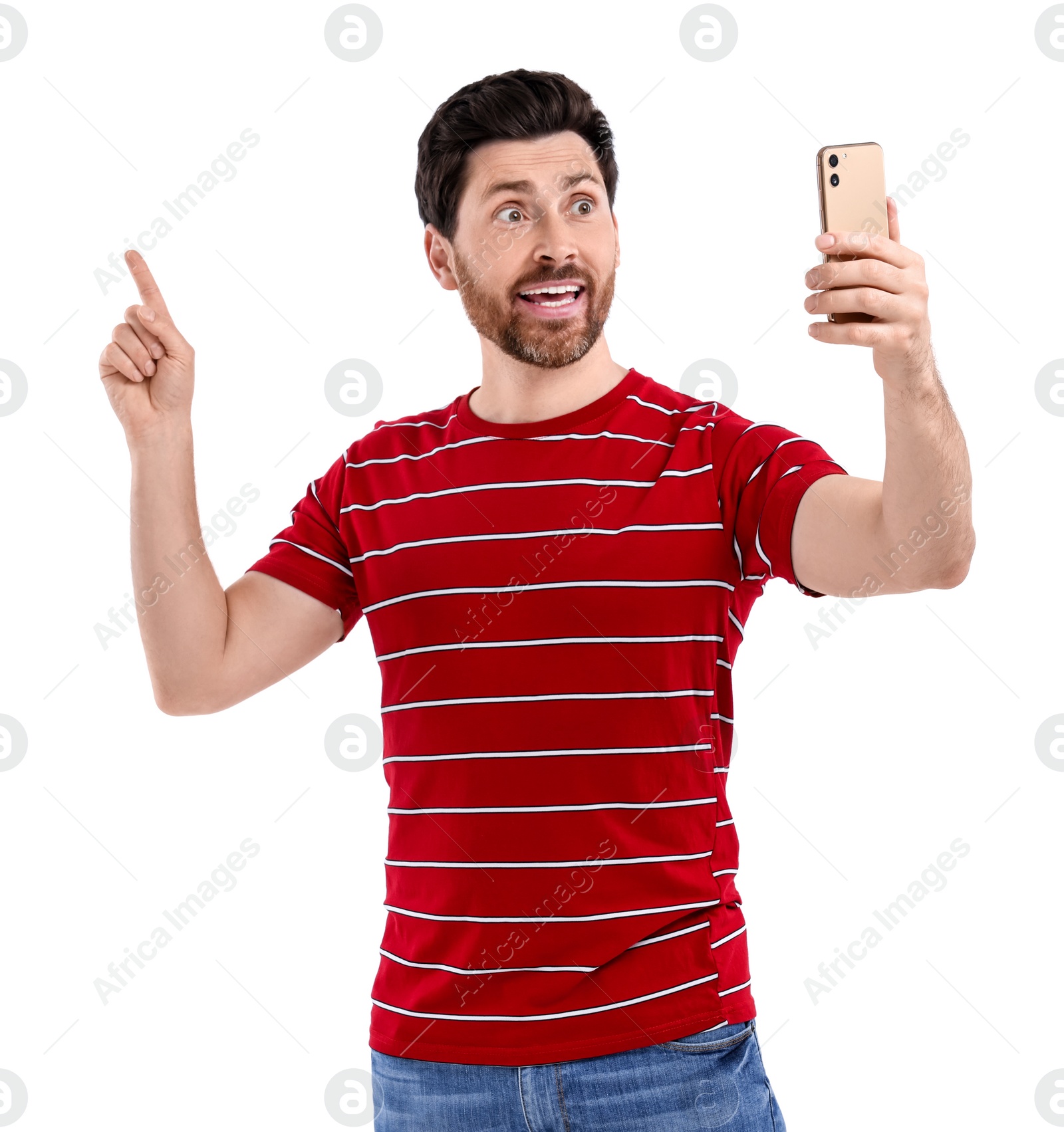 Photo of Emotional man taking selfie with smartphone on white background