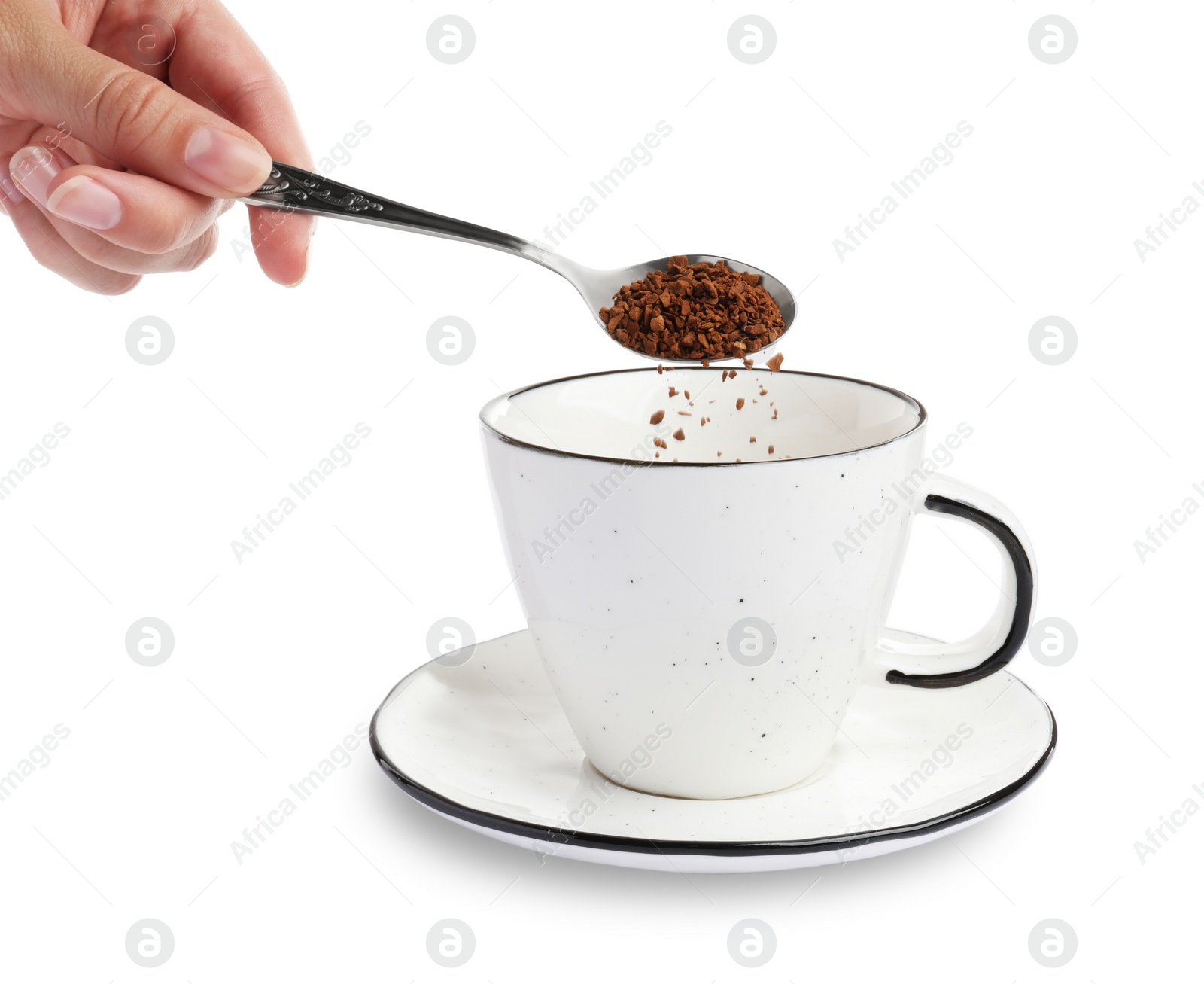 Photo of Woman pouring instant coffee into cup on white background, closeup