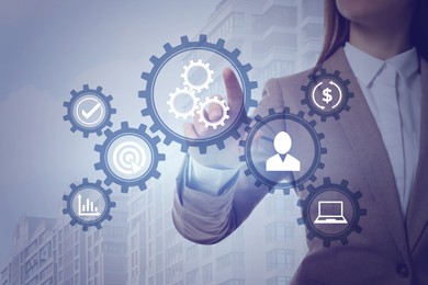 Image of Business process. Woman touching virtual screen with different icons, closeup