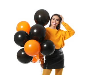 Photo of Beautiful woman with balloons on white background. Halloween party