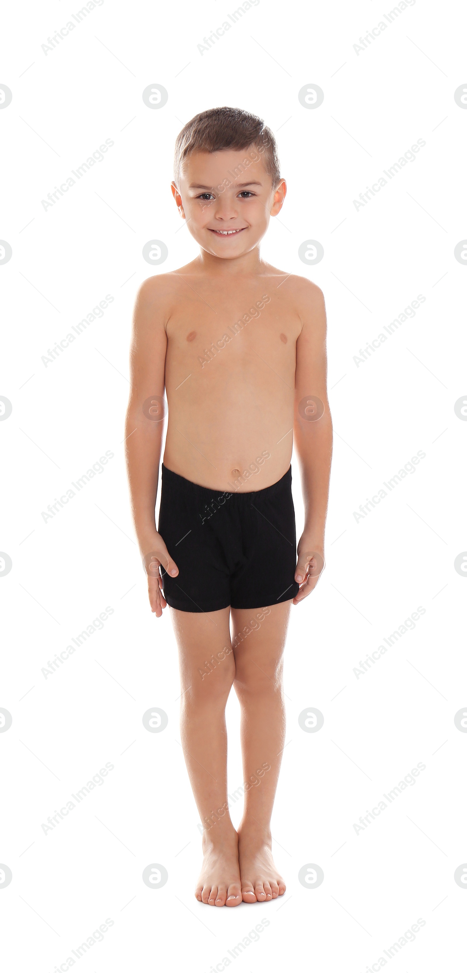 Photo of Cute little boy in underwear on white background