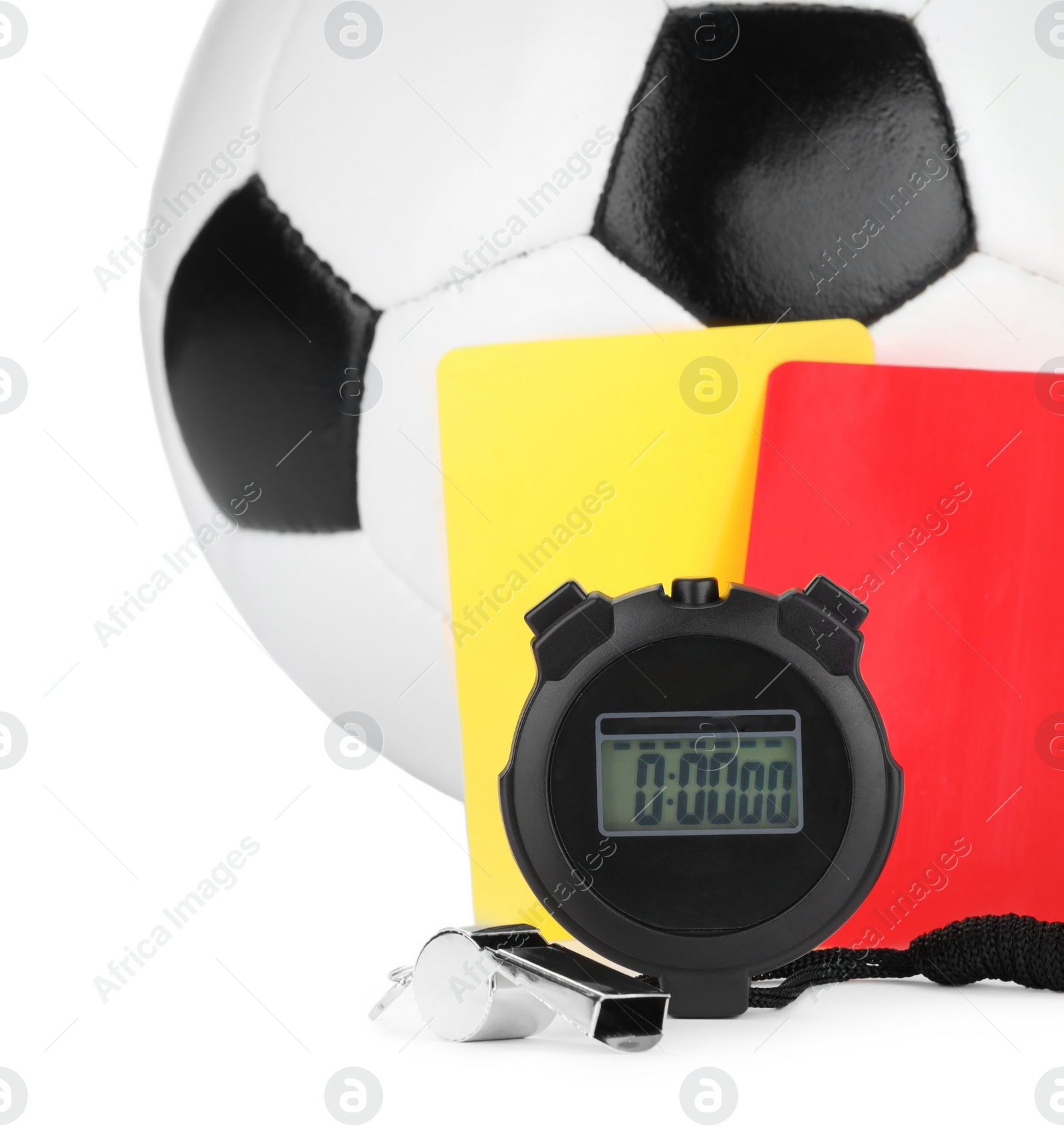 Photo of Referee equipment. Soccer ball, whistle, stopwatch and cards isolated on white