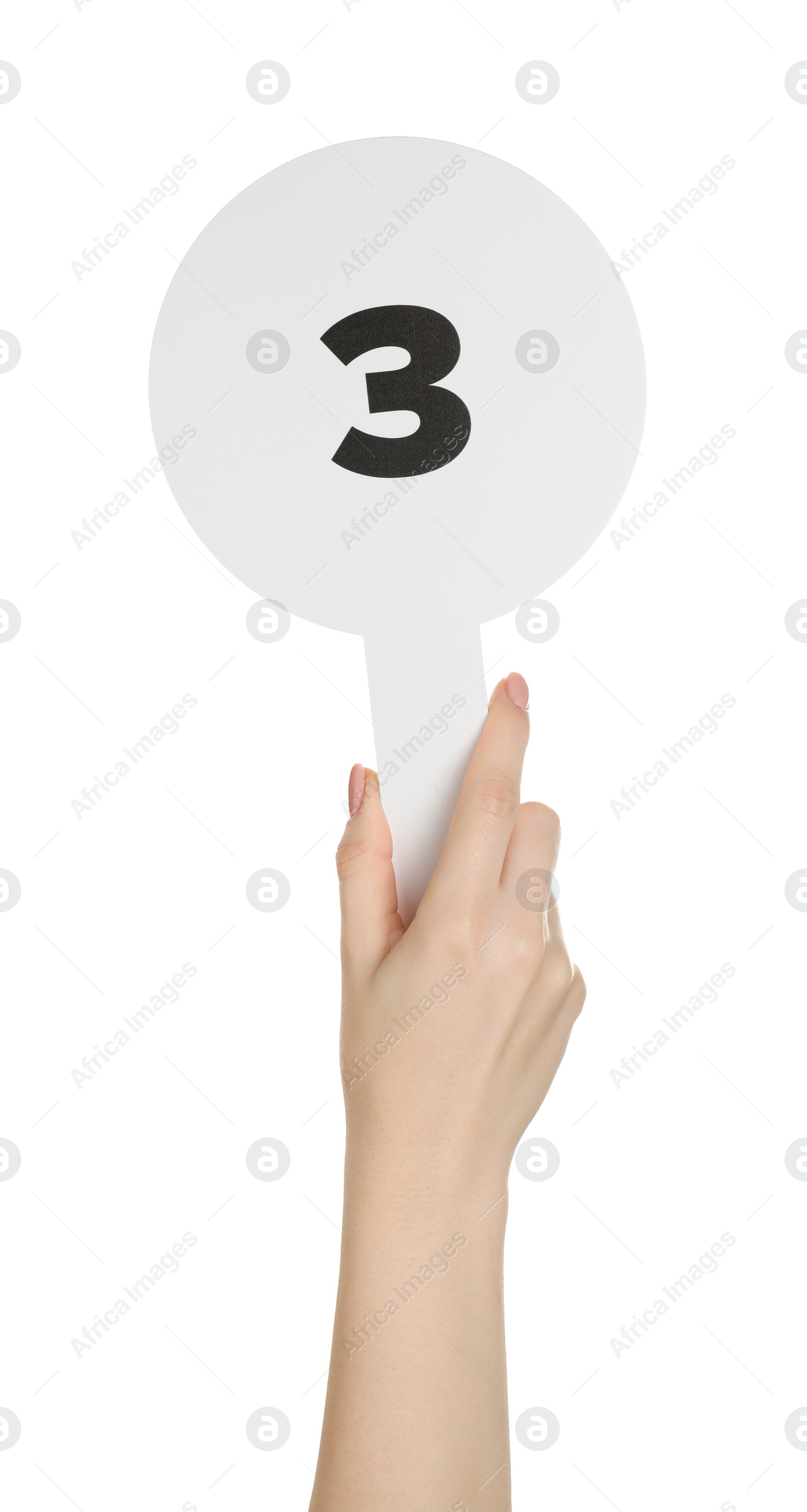 Photo of Woman holding auction paddle with number 3 on white background, closeup