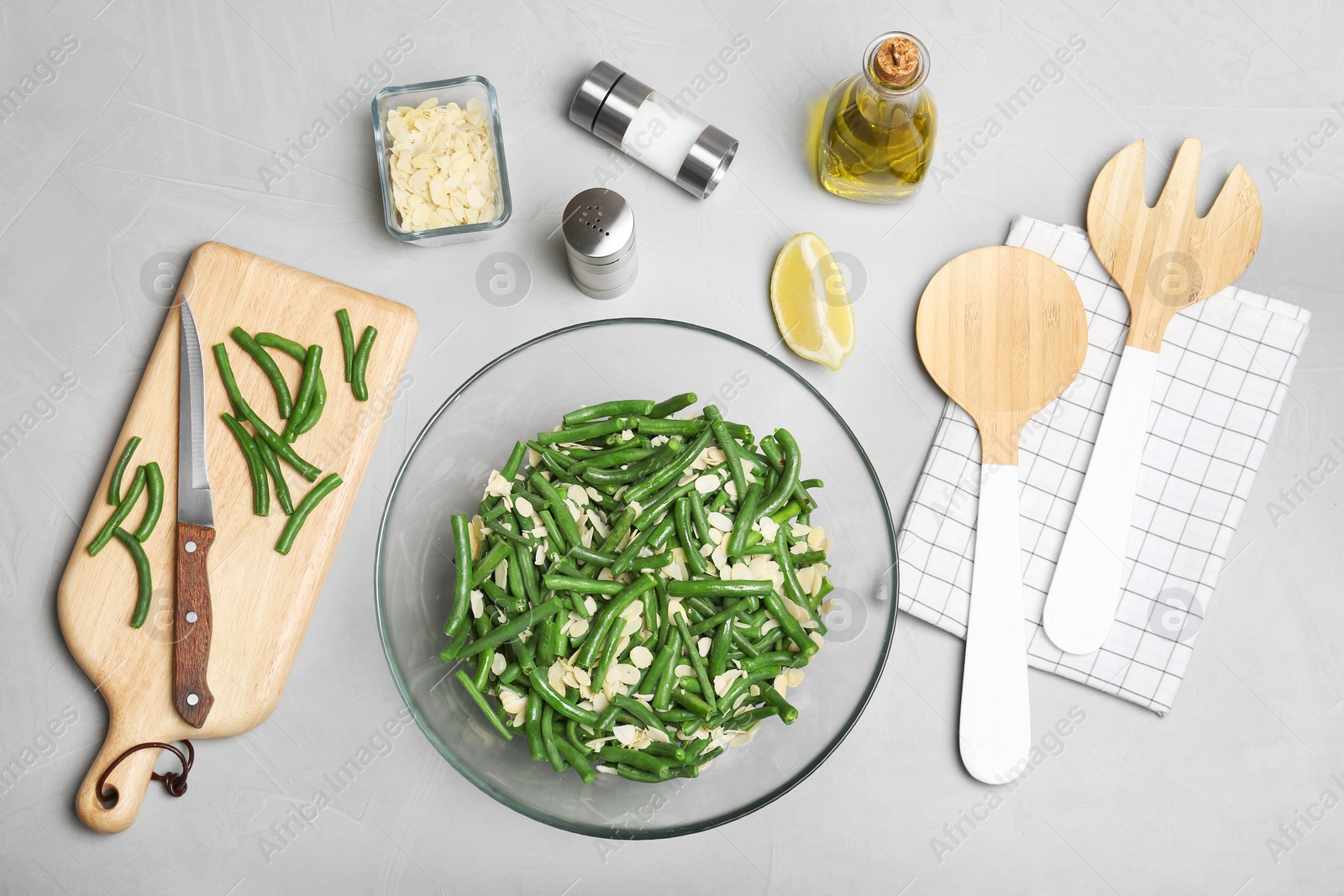 Photo of Flat lay composition with tasty green beans and almonds on table