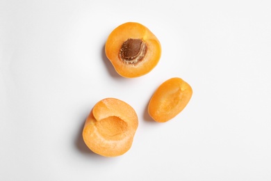 Delicious ripe sweet apricots on white background, top view