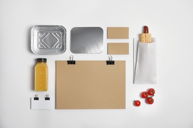 Photo of Flat lay composition with items for mock up design on light background. Food delivery service