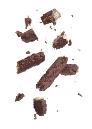 Image of Pieces of tasty chocolate bars falling on white background