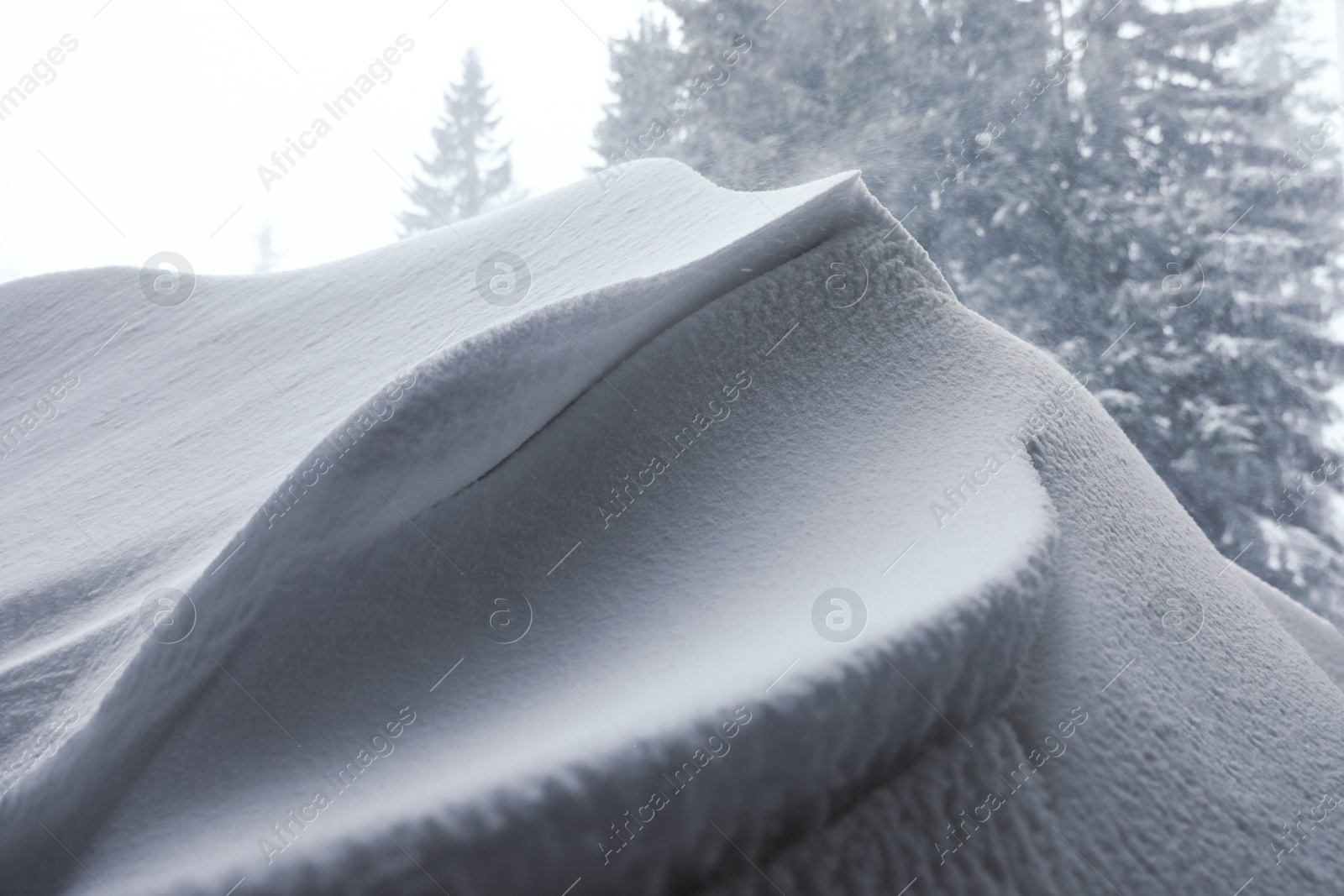 Photo of Beautiful snowdrift outdoors, closeup view/ Winter season
