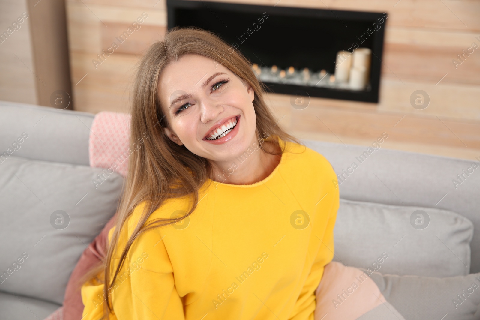 Photo of Portrait of young woman laughing at home