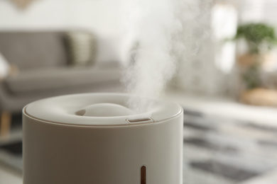 Photo of Modern humidifier indoors, closeup view. Home appliance