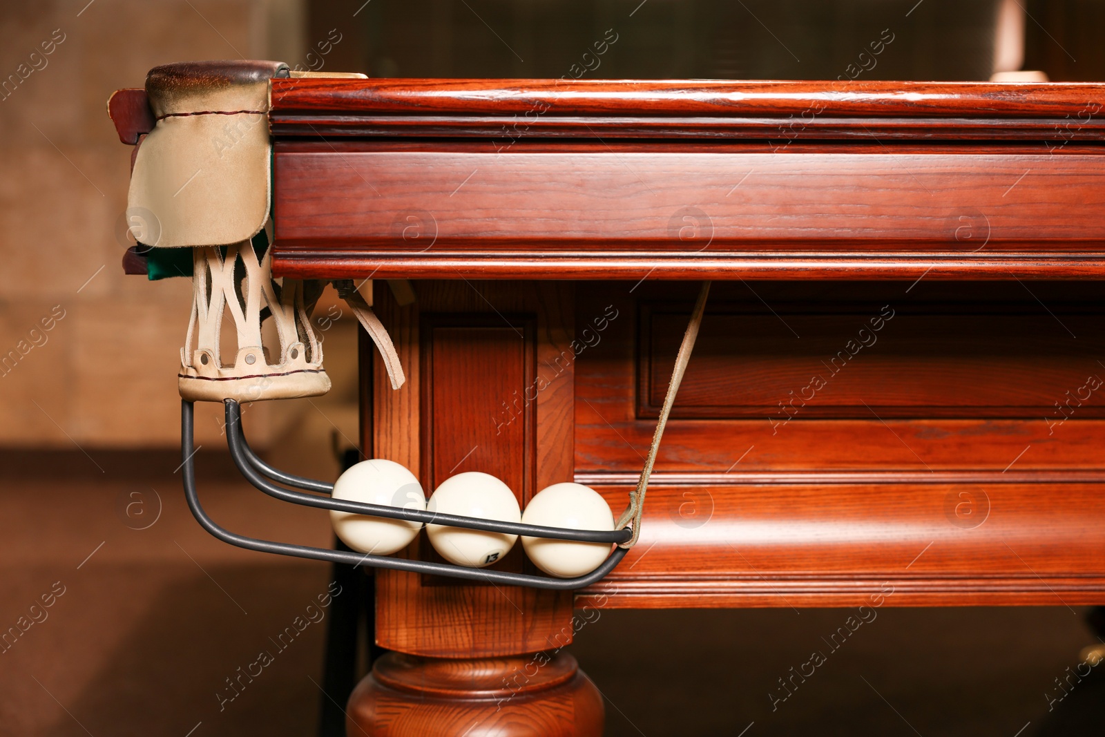 Photo of White balls in billiard table pocket indoors, closeup