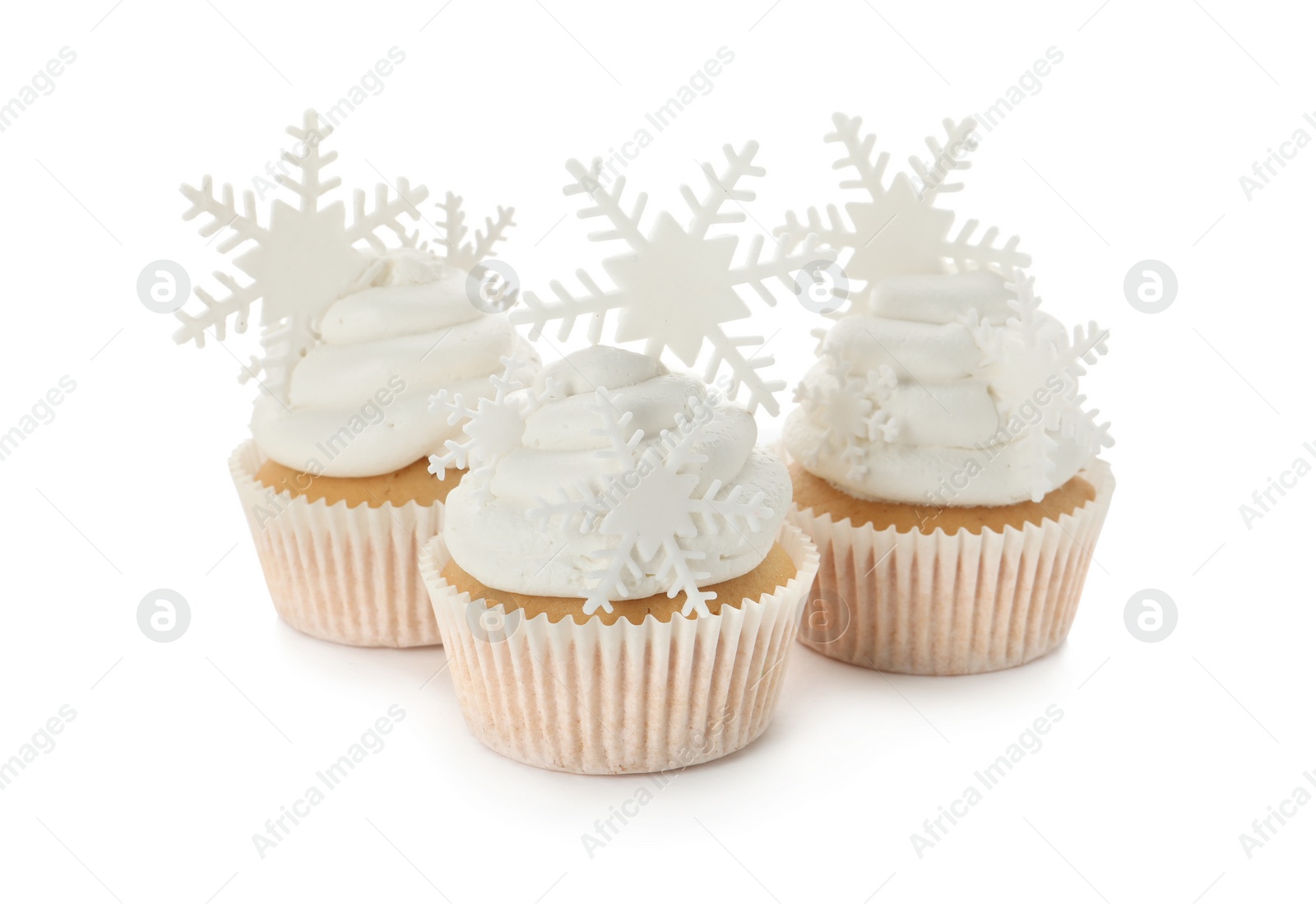 Photo of Tasty Christmas cupcakes with snowflakes on white background