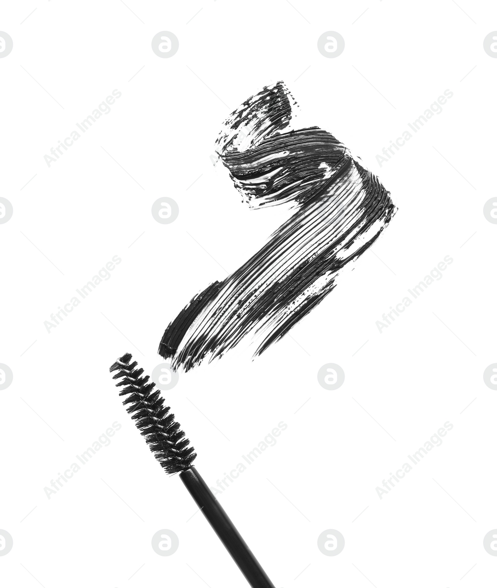 Photo of Smear of mascara and applicator isolated on white, top view