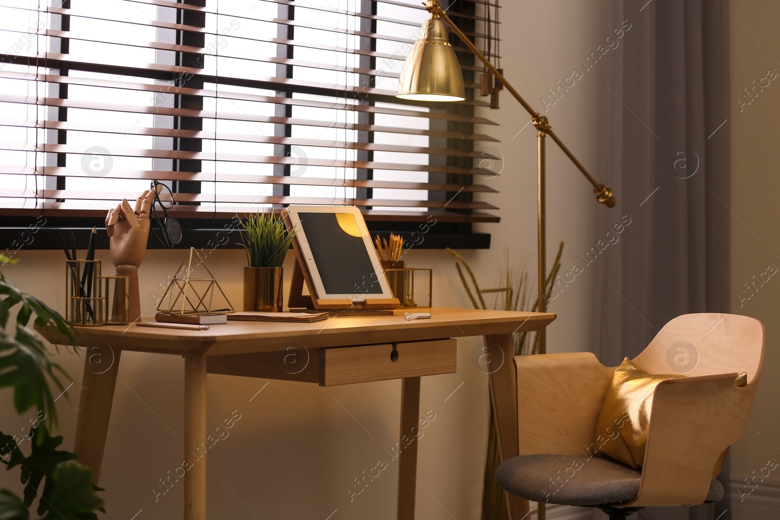 Photo of Stylish room interior with modern workplace at window