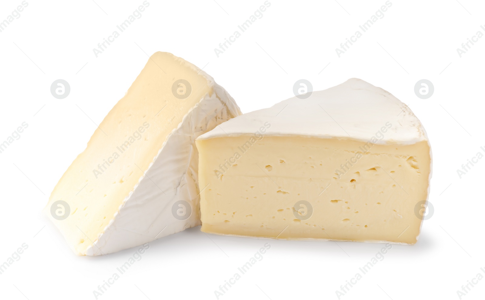 Photo of Pieces of tasty camembert cheese isolated on white