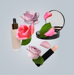 Image of Different makeup products and beautiful roses in air on grey background