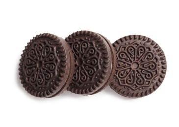 Photo of Tasty chocolate cookies with cream on white background, top view