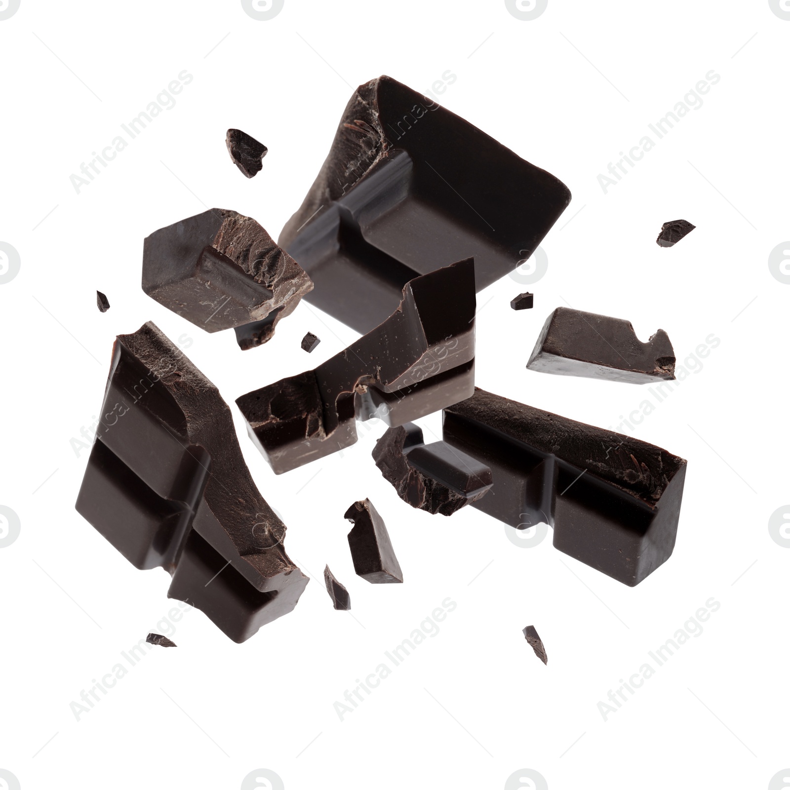 Image of Dark chocolate explosion, pieces shattering on white background