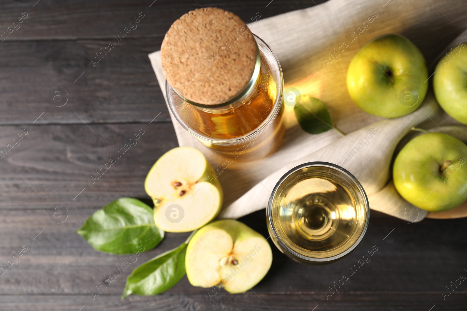 Photo of Flat lay composition with delicious apple cider on wooden table