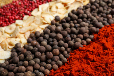 Photo of Many different spices as background, closeup view