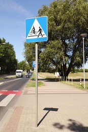 Photo of Road sign Pedestrian and Bicycle Crossings outdoors on sunny day