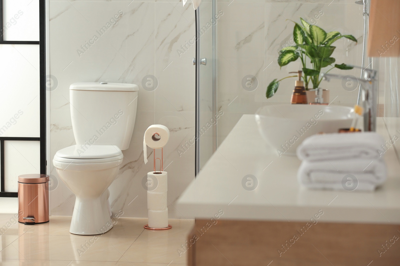 Photo of Interior of modern bathroom with toilet bowl