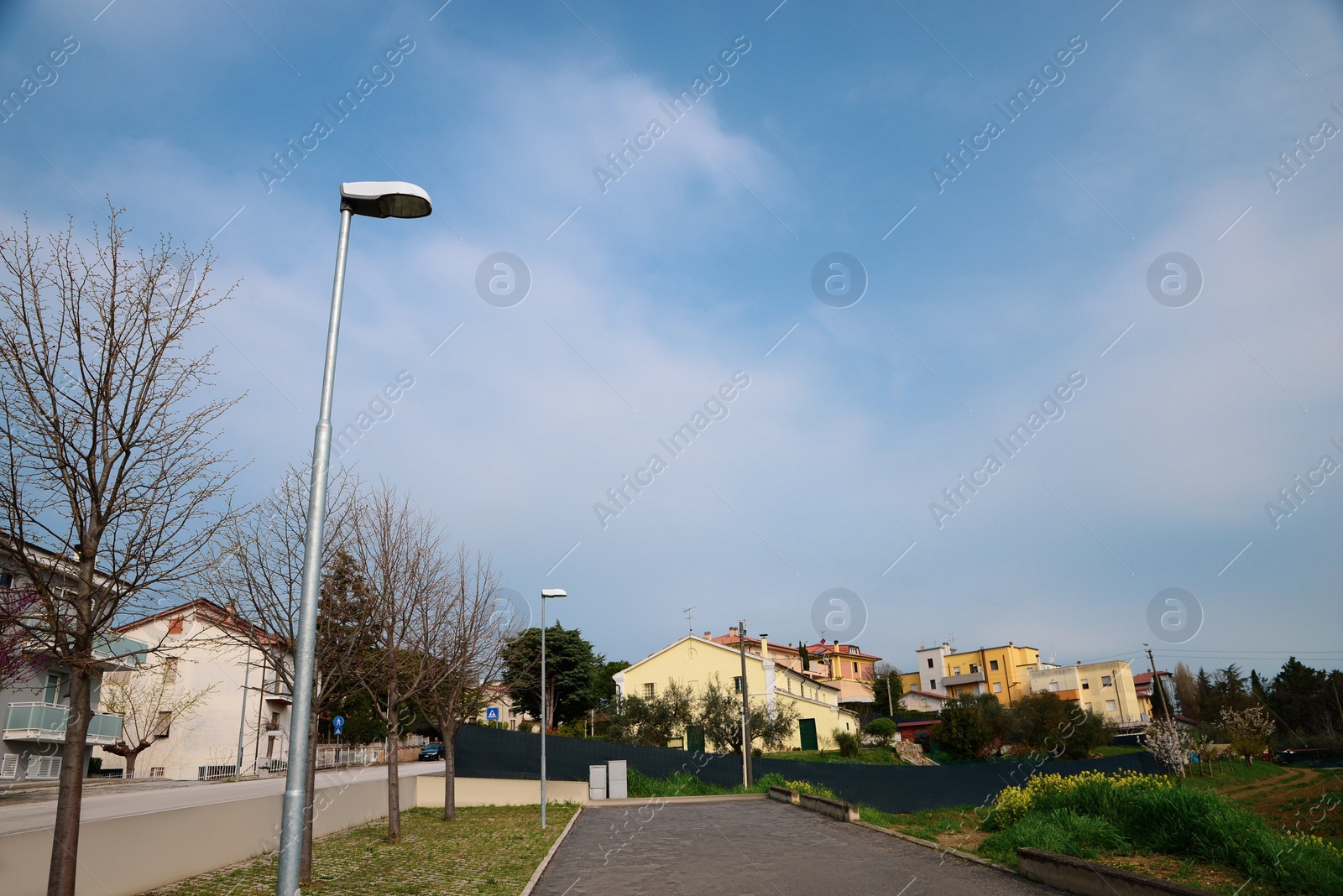 Photo of Picturesque view of beautiful city with street lamps and buildings
