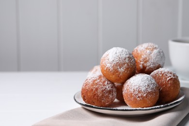 Photo of Delicious sweet buns on white table, space for text