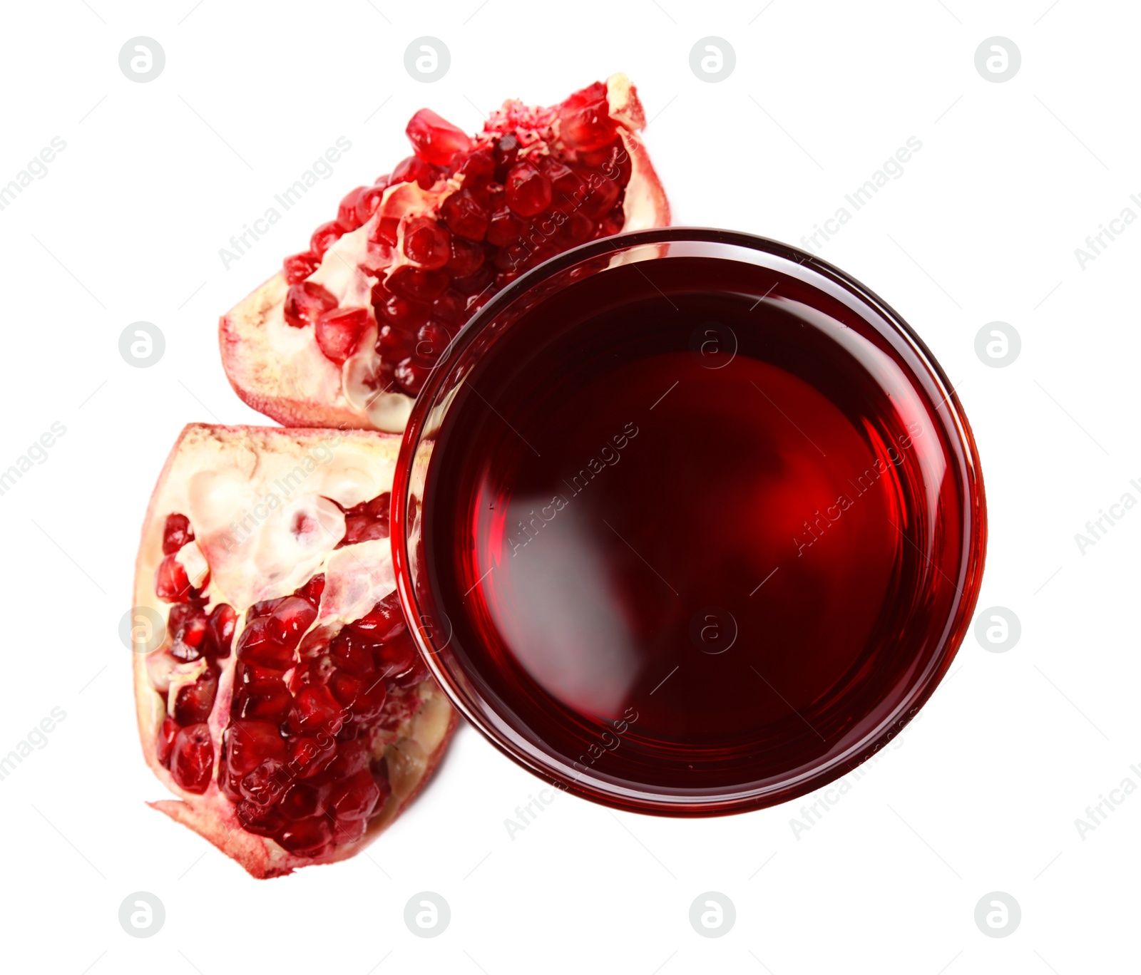 Photo of Freshly made pomegranate juice in glass on white background, top view