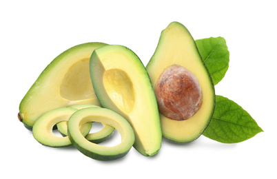 Cut fresh avocados with leaves on white background