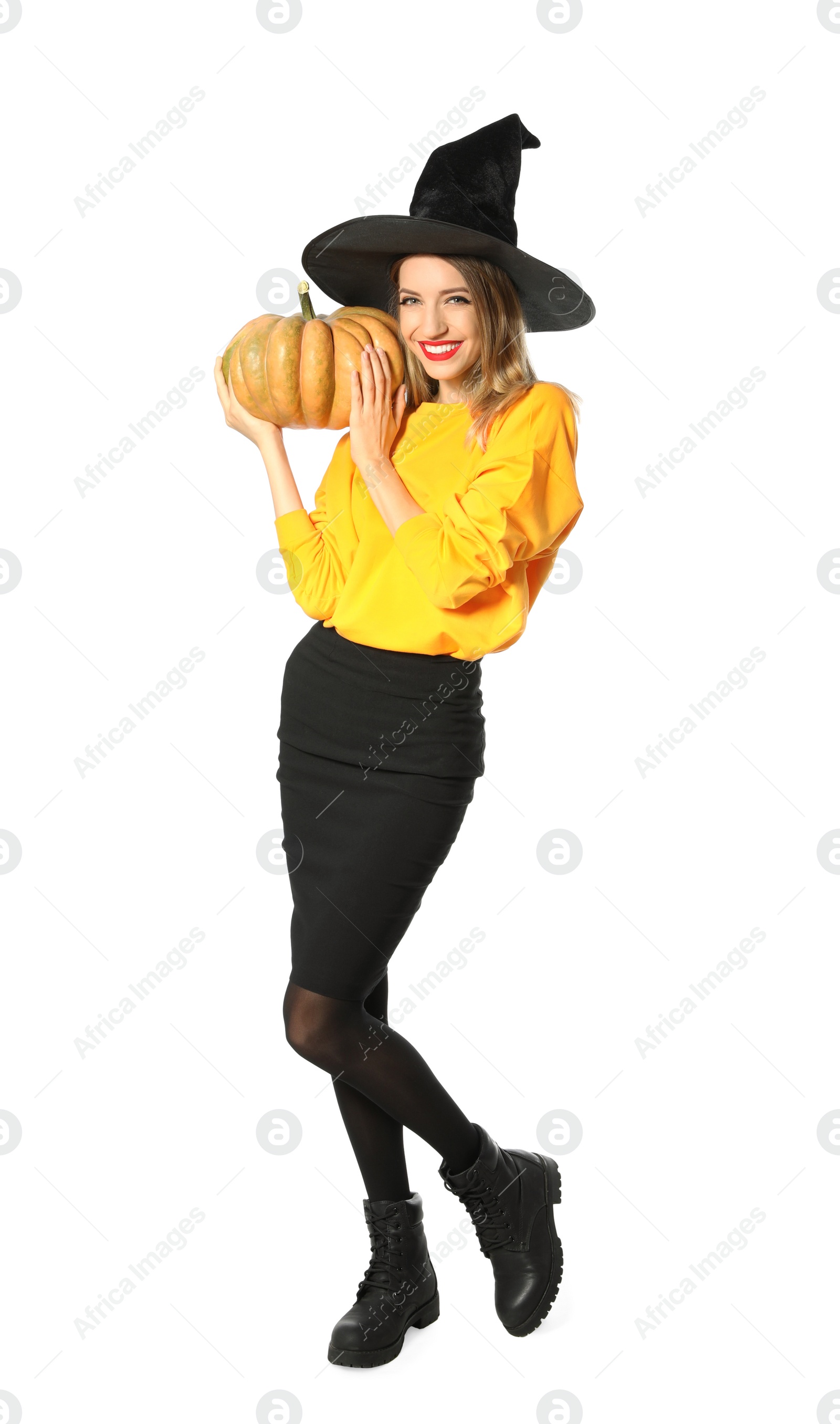 Photo of Beautiful woman wearing witch costume with pumpkin for Halloween party on white background