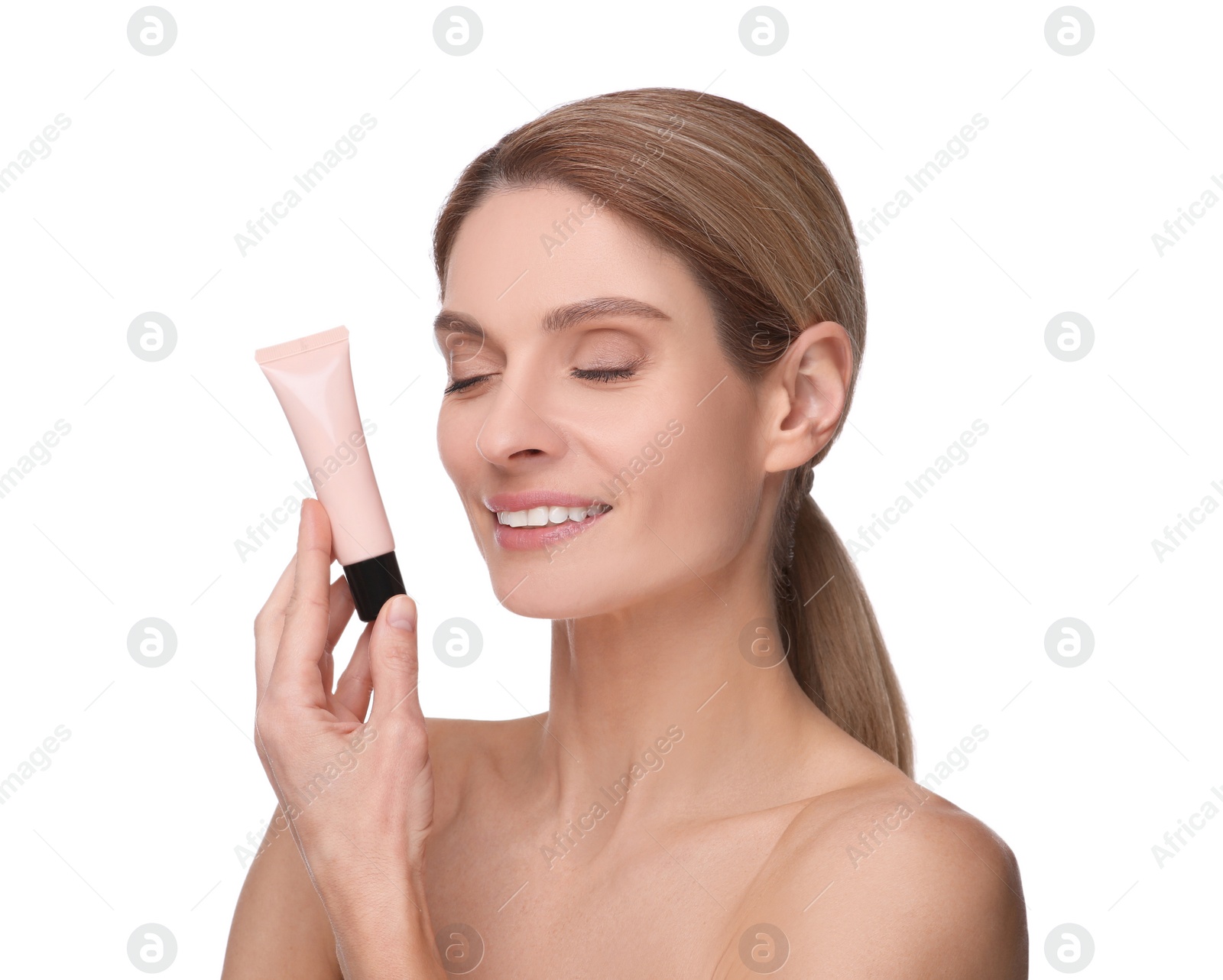 Photo of Woman holding tube with foundation on white background