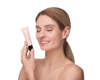 Photo of Woman holding tube with foundation on white background