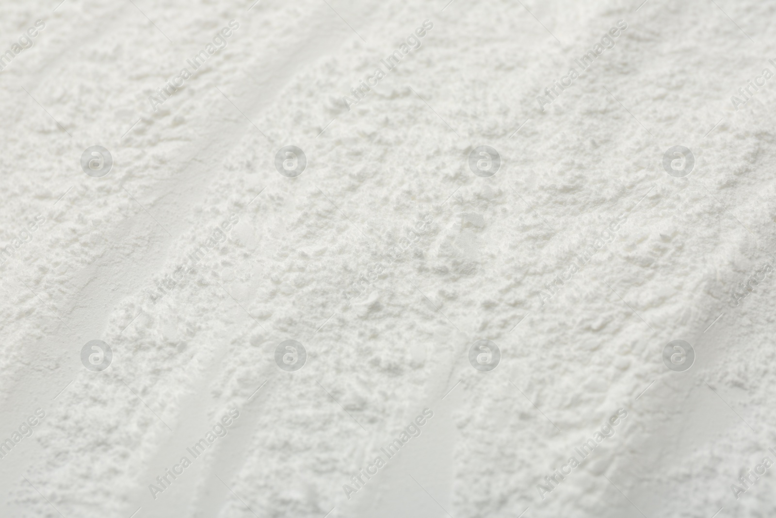 Photo of Texture of baking powder as background, closeup